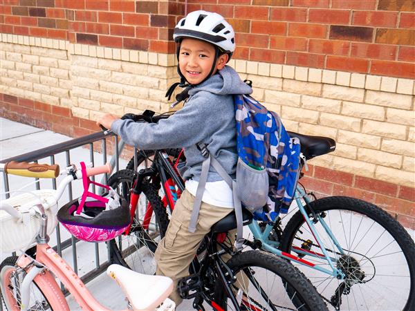 Students bike to school in the morning.